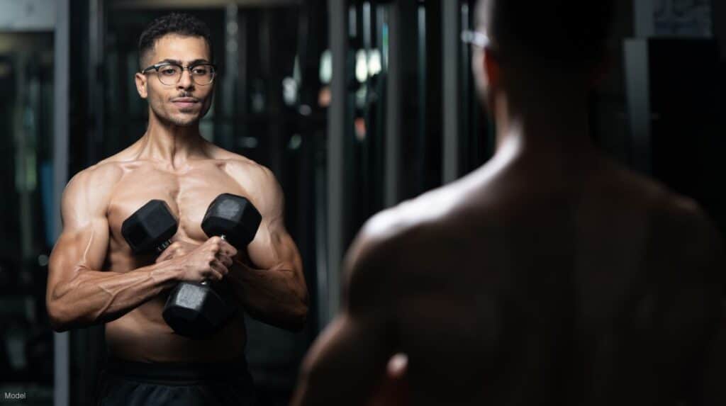 Man working out in front of a mirror