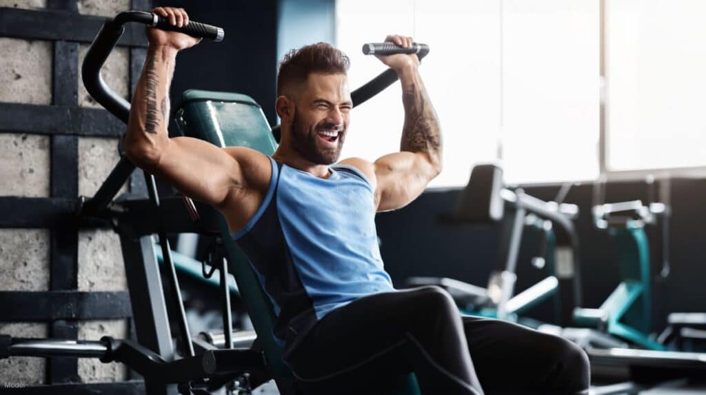 man doing some chest exercise at the gym